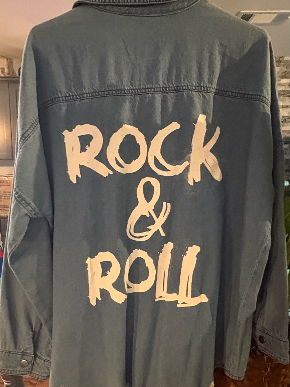 Distressed Denim Jacket (with painted rock n’ roll) on the back.
